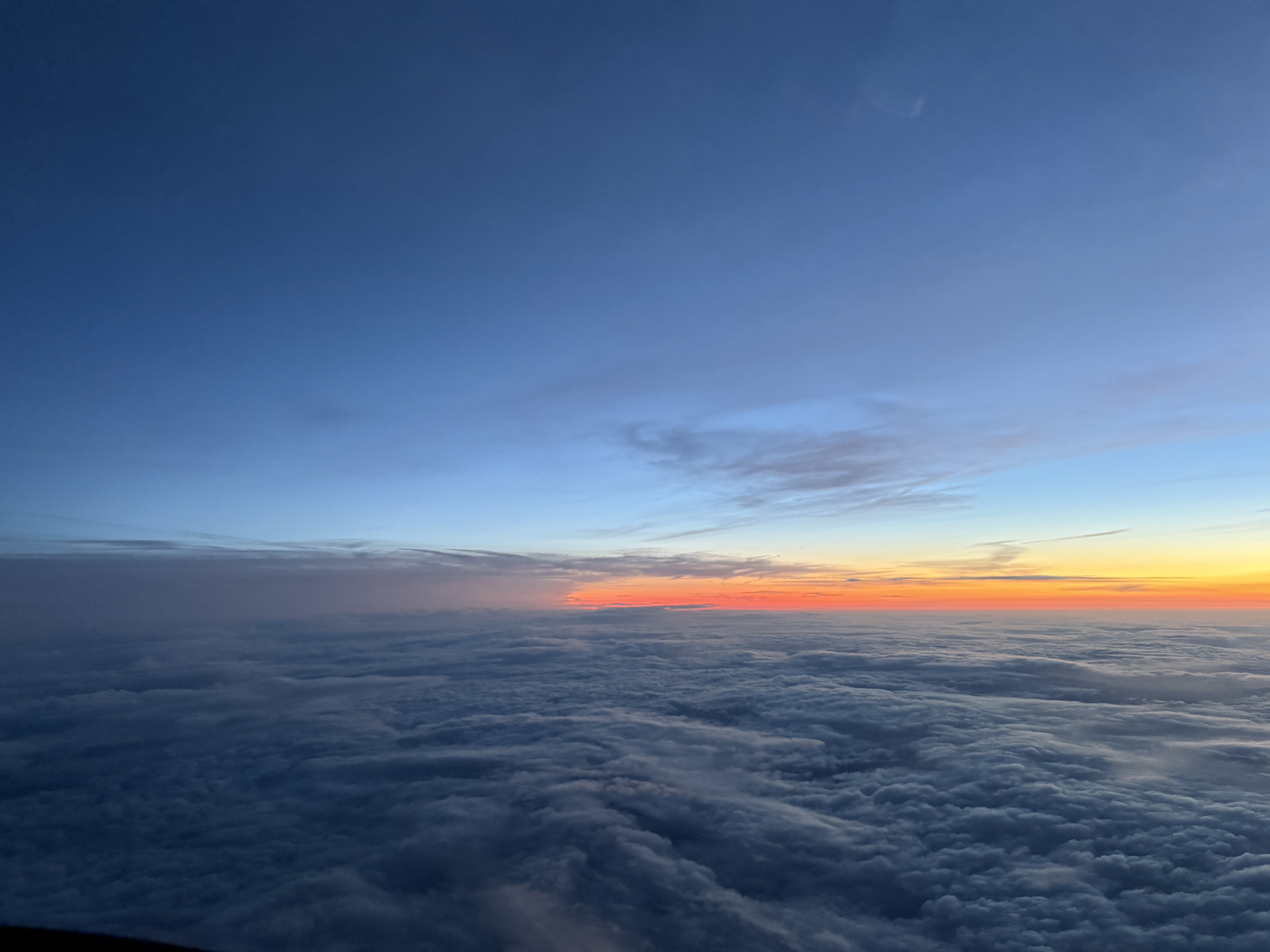 Sunset above the clouds from a Cirrus cockpit